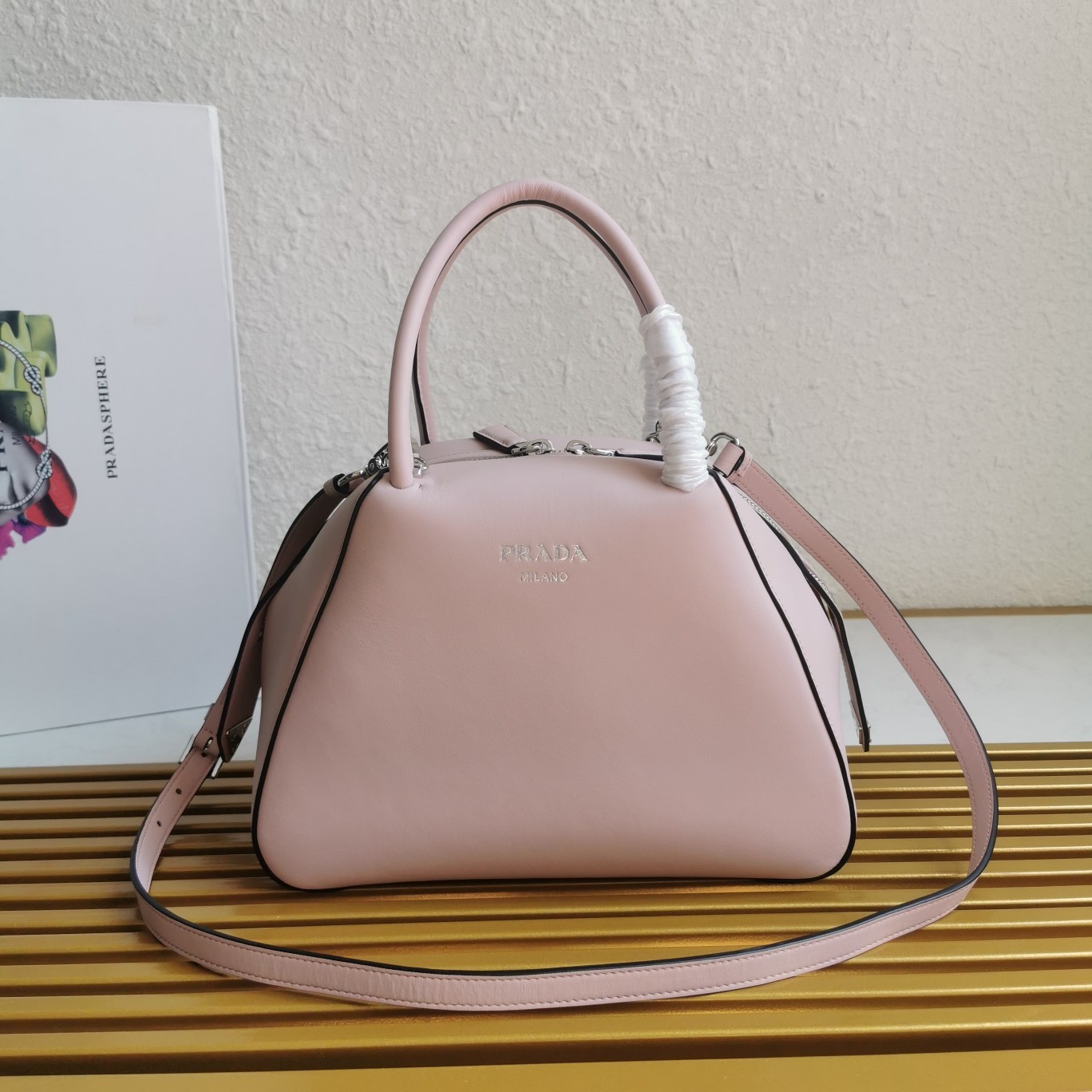 pra*a S*pernova small handbag in pink leather