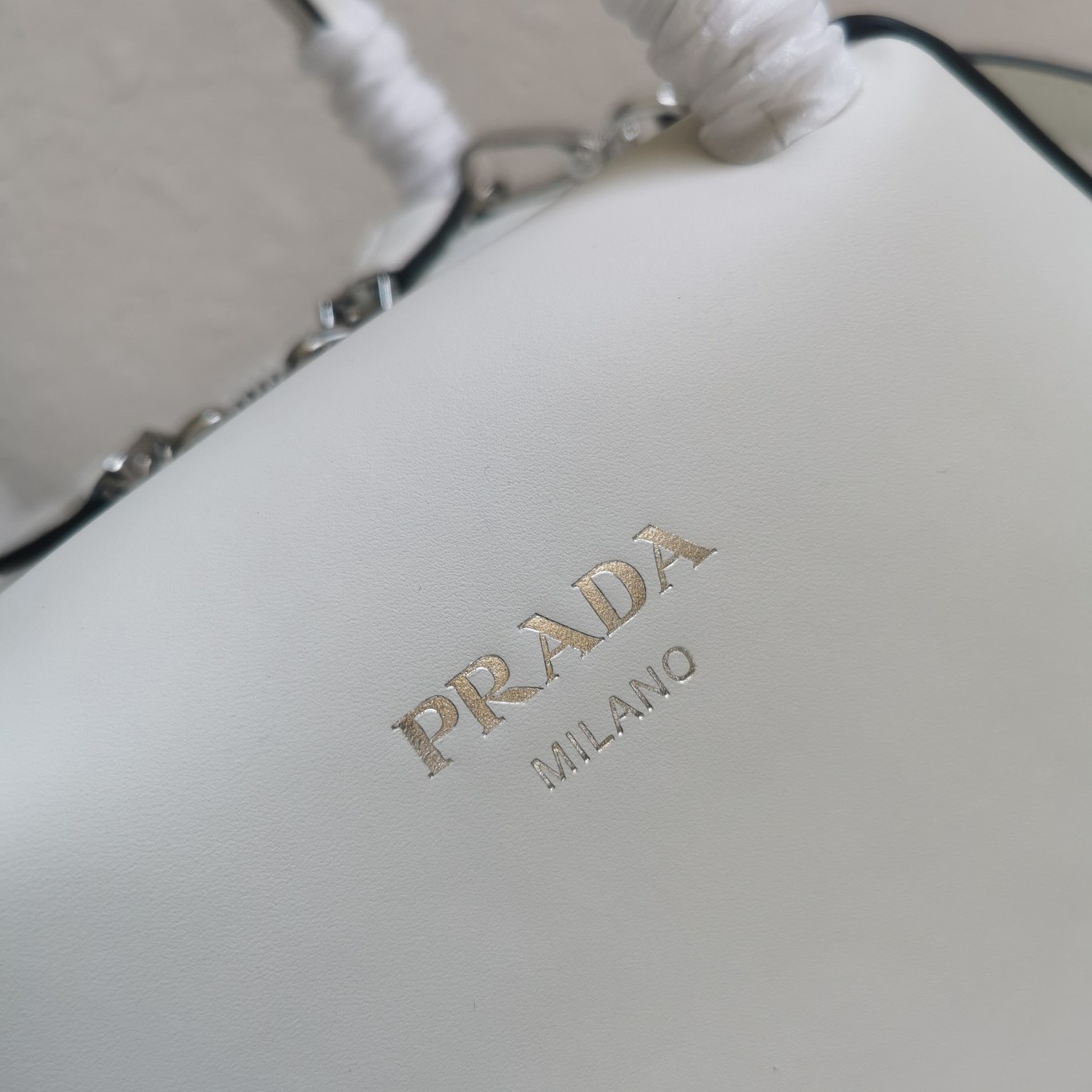 pra*a S*pernova small handbag in white leather