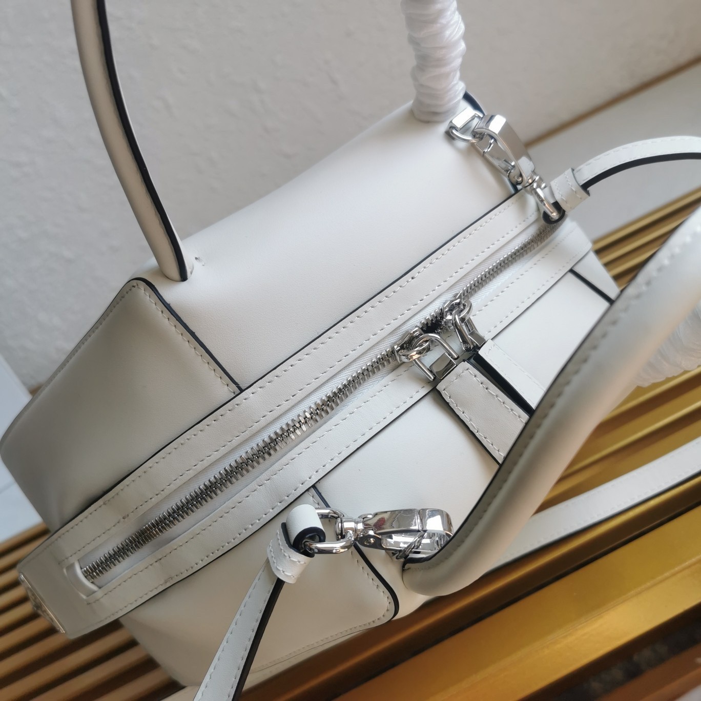 pra*a S*pernova small handbag in white leather