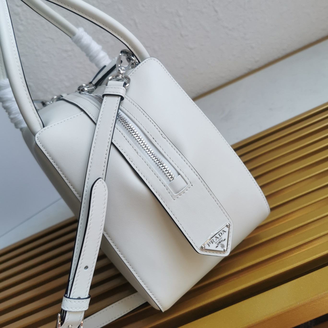 pra*a S*pernova small handbag in white leather