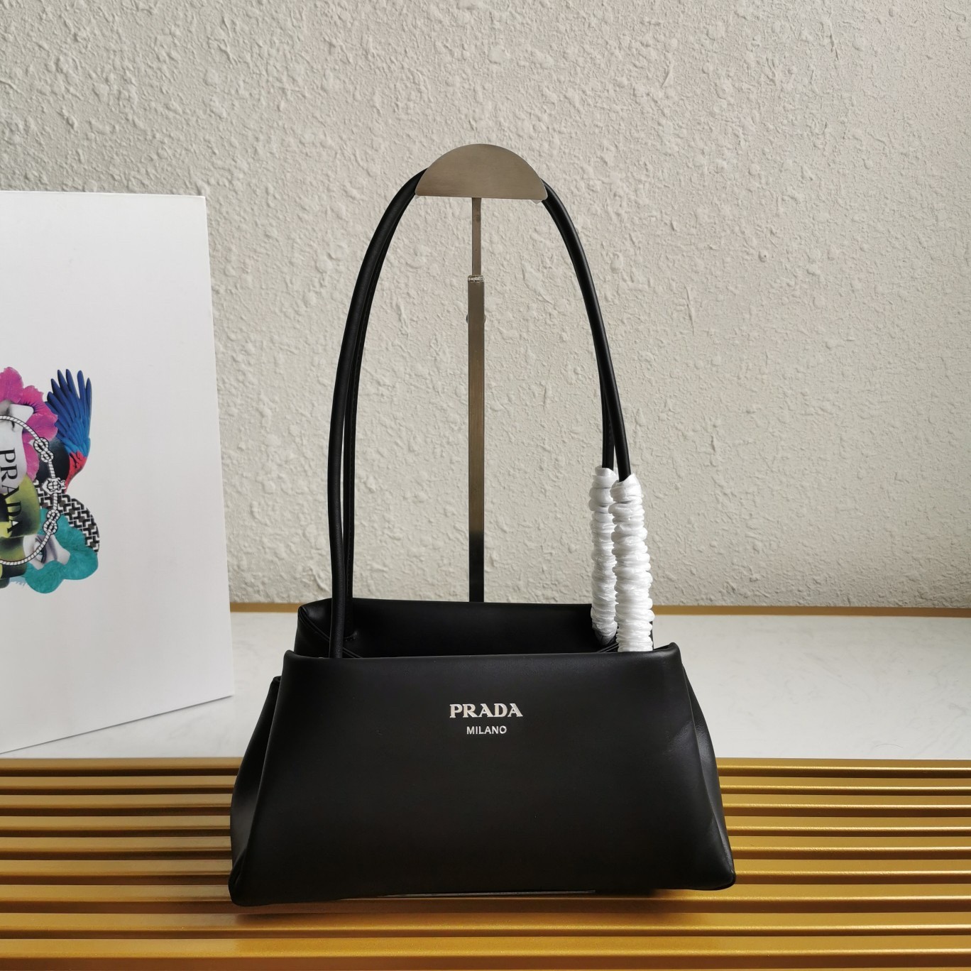 pra*a S*pernova small shoulder bag in black leather