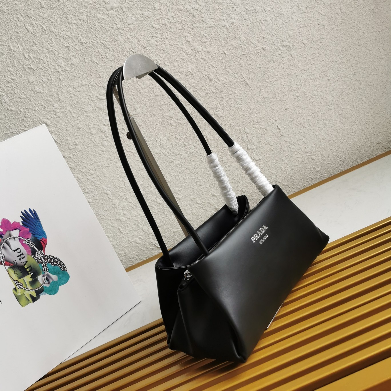 pra*a S*pernova small shoulder bag in black leather