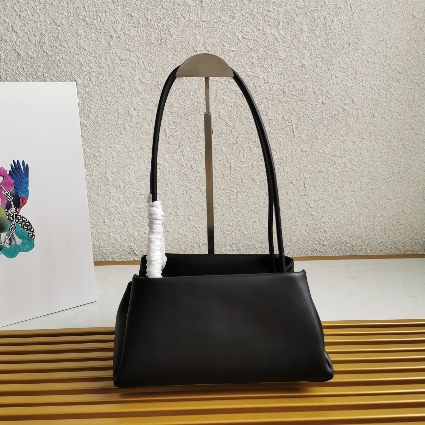 pra*a S*pernova small shoulder bag in black leather