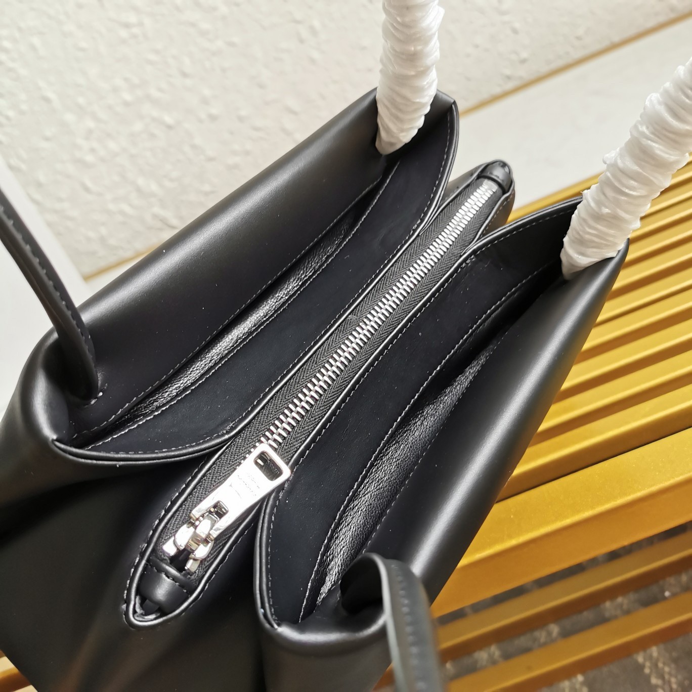 pra*a S*pernova small shoulder bag in black leather