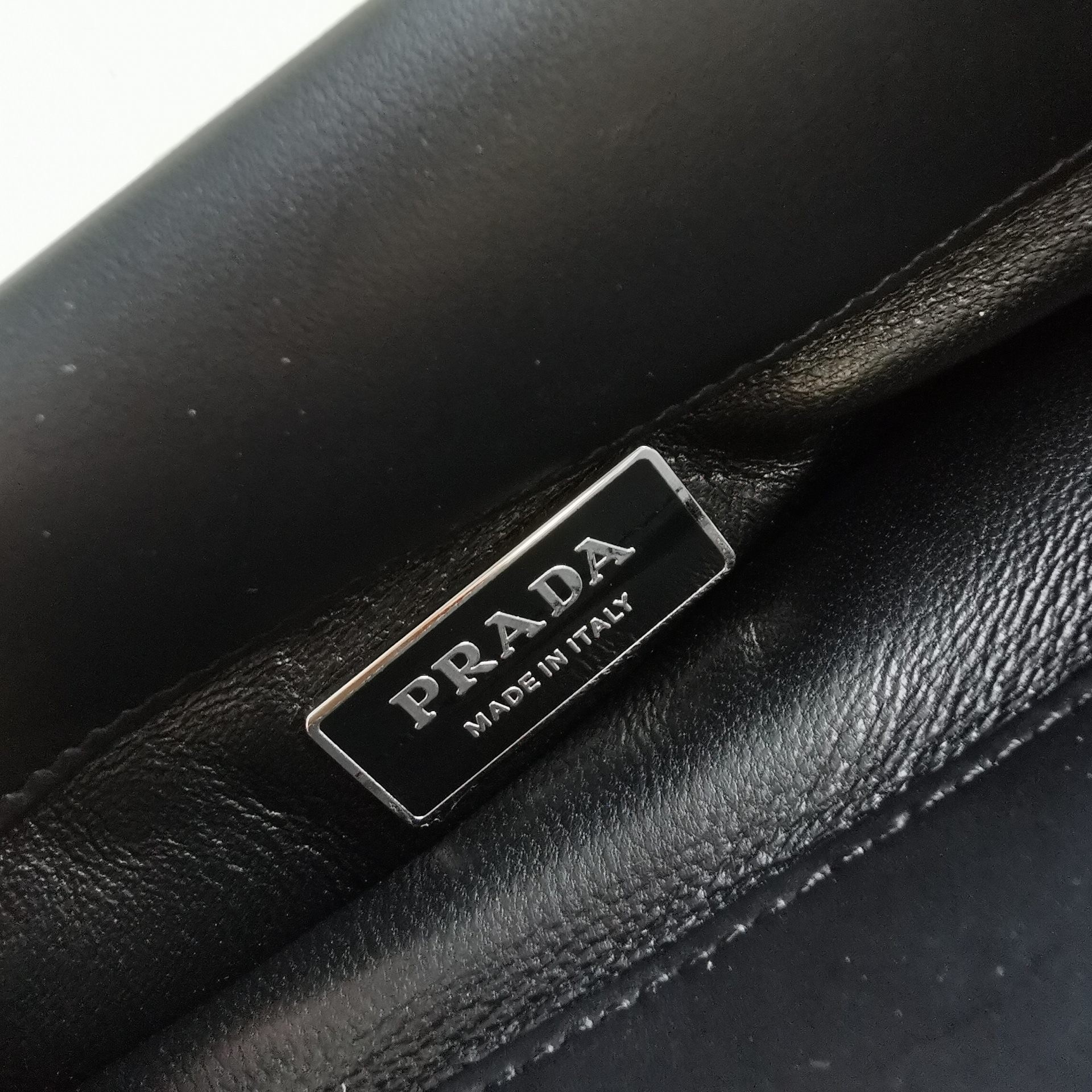 pra*a S*pernova small shoulder bag in black leather