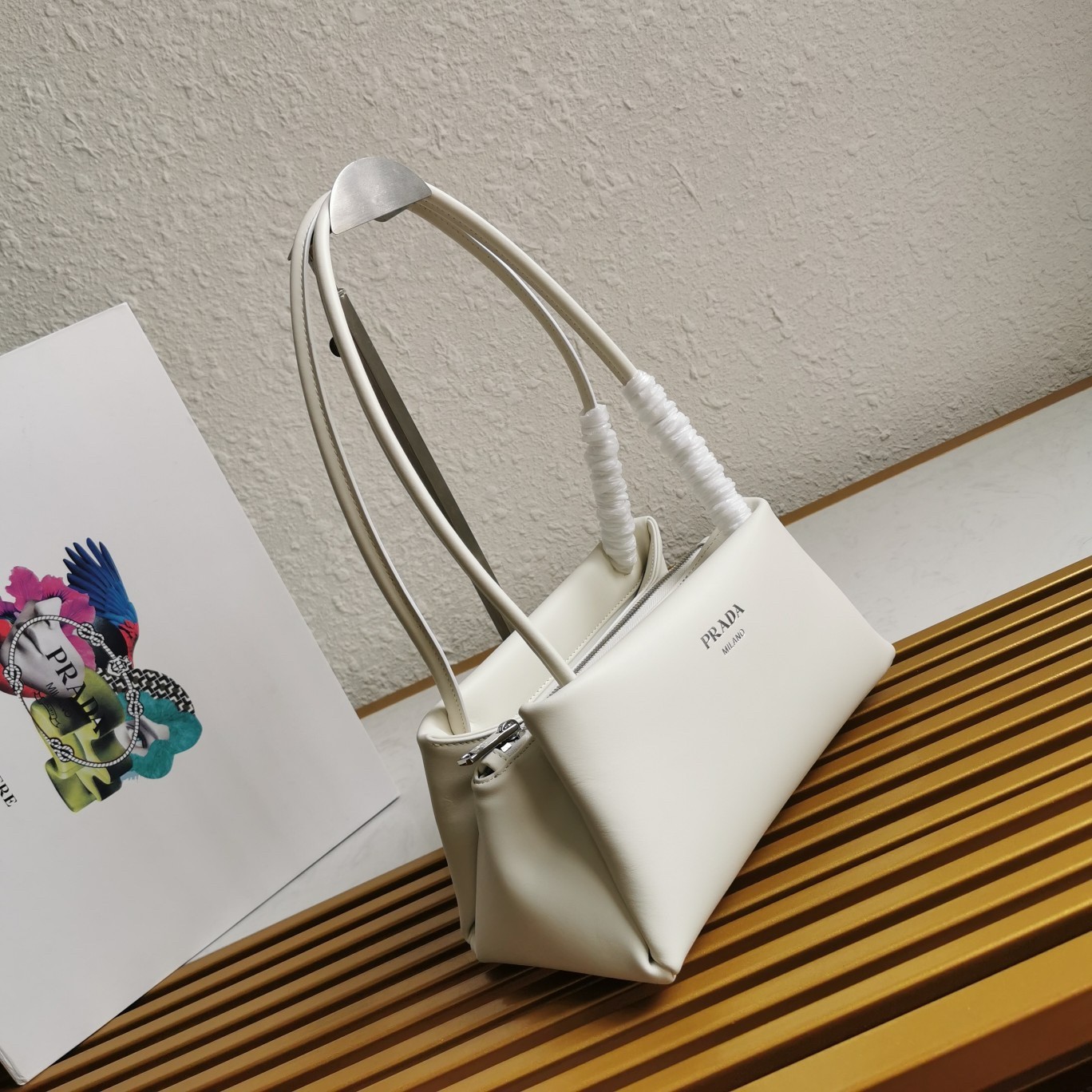 pra*a S*pernova small shoulder bag in white leather