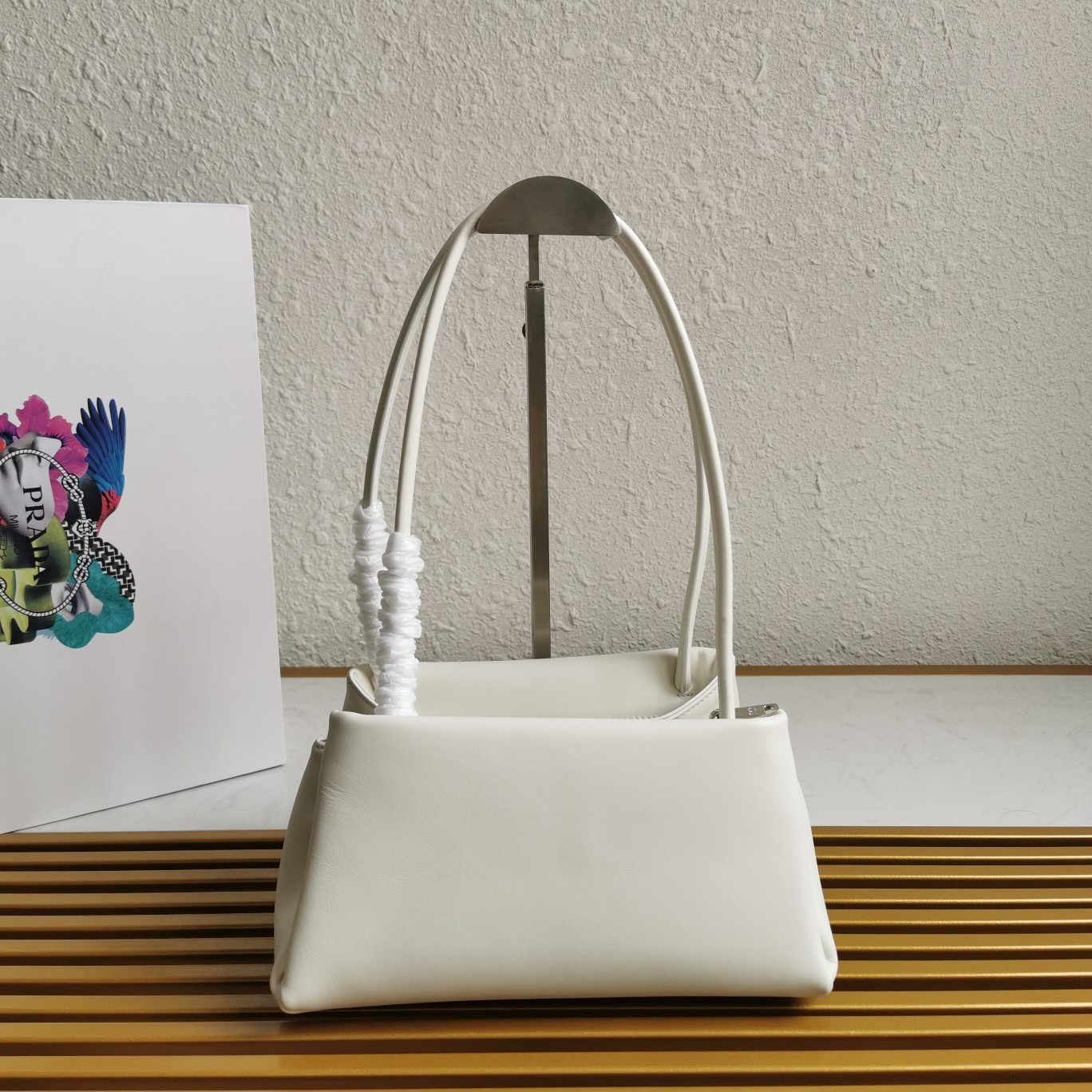 pra*a S*pernova small shoulder bag in white leather
