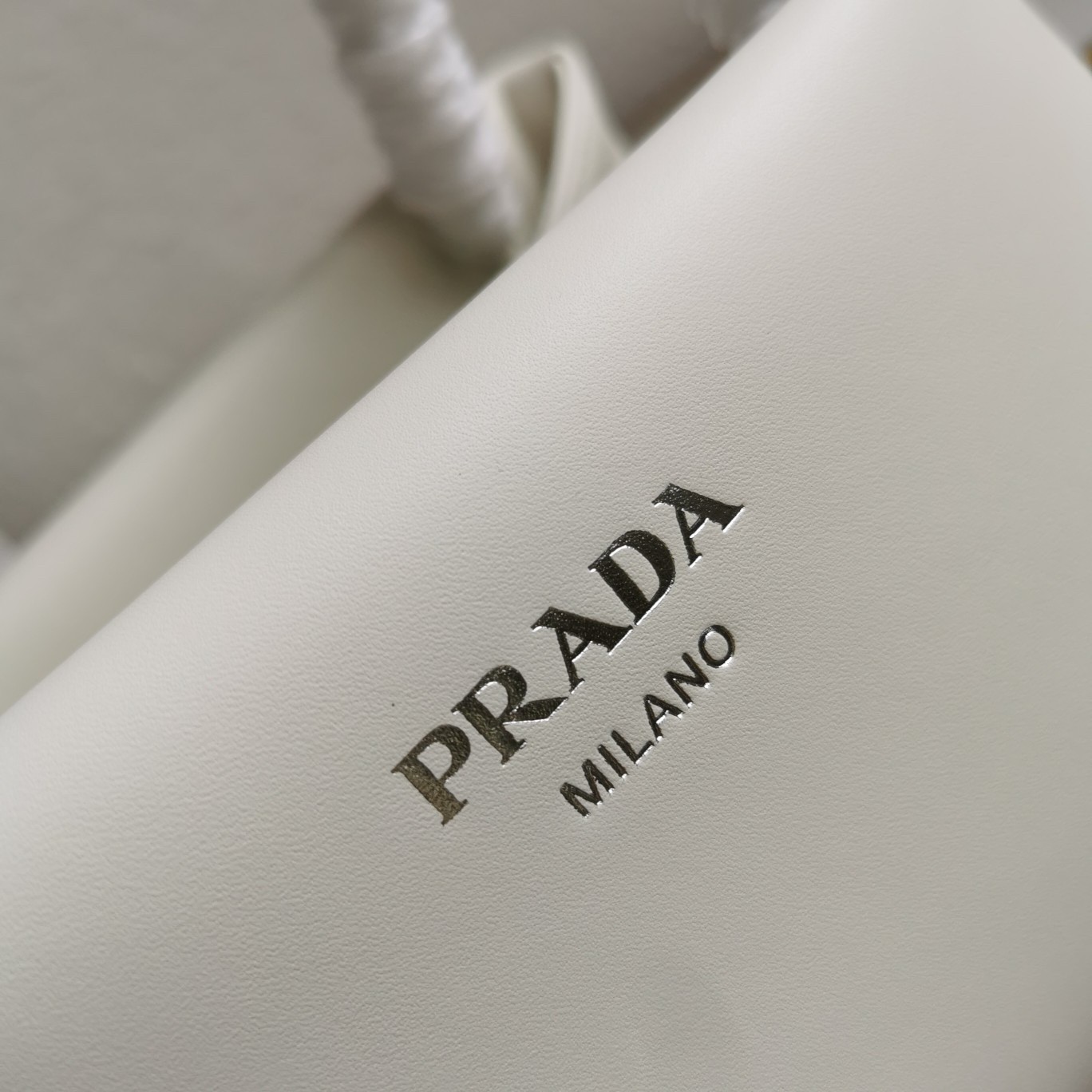 pra*a S*pernova small shoulder bag in white leather