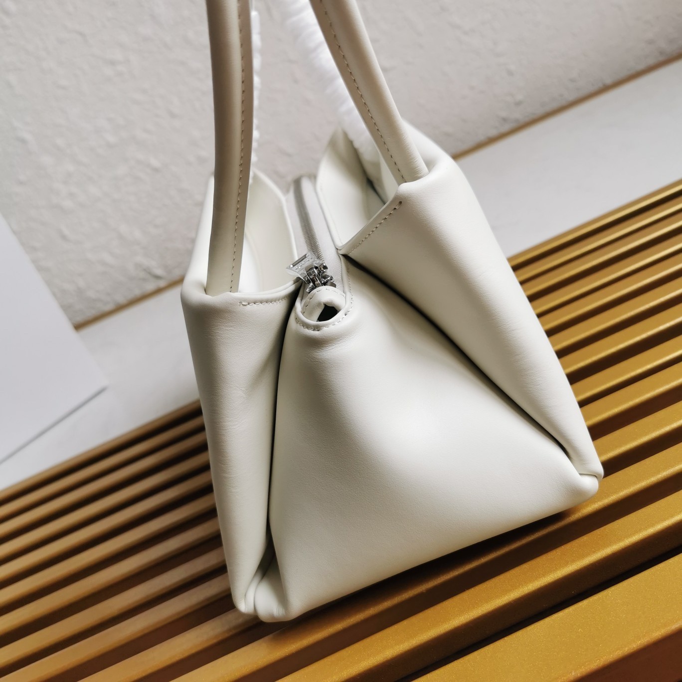 pra*a S*pernova small shoulder bag in white leather
