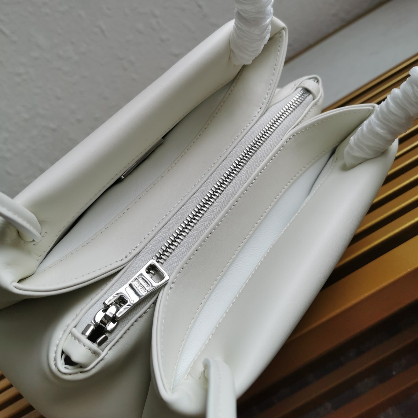 pra*a S*pernova small shoulder bag in white leather