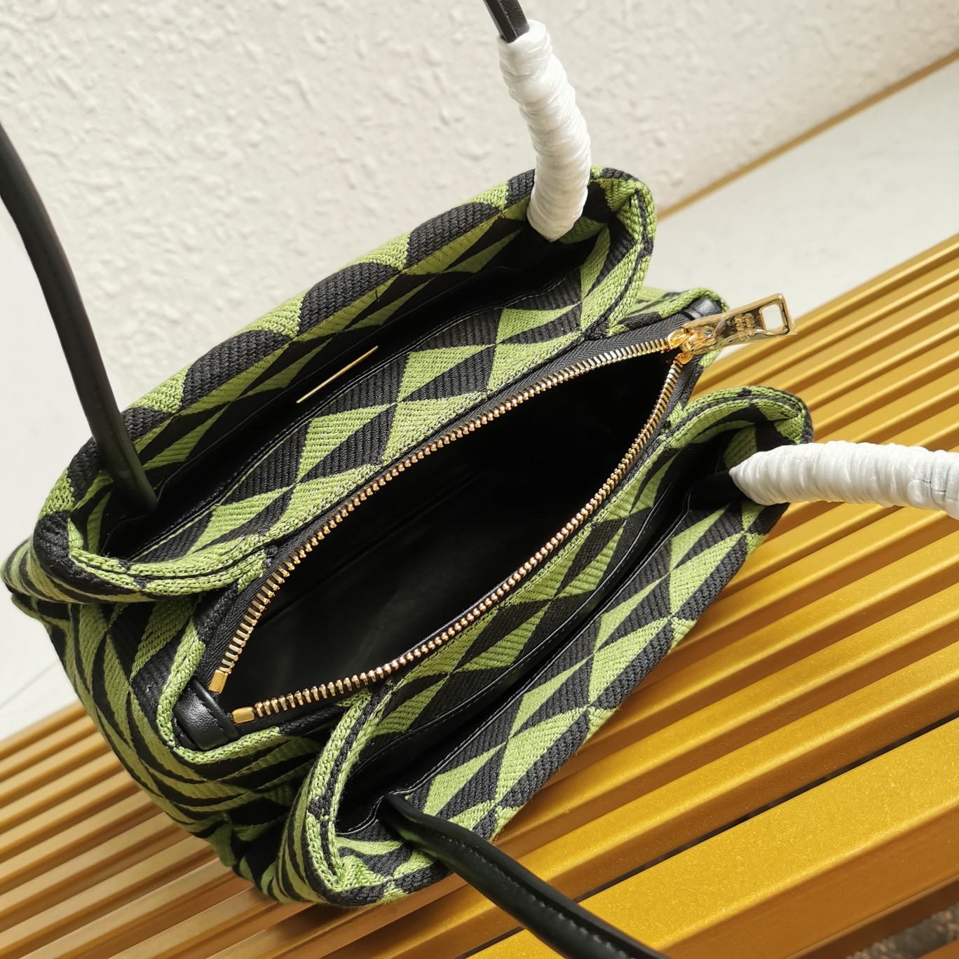 pra*a S*pernova small shoulder bag in black/green fabric