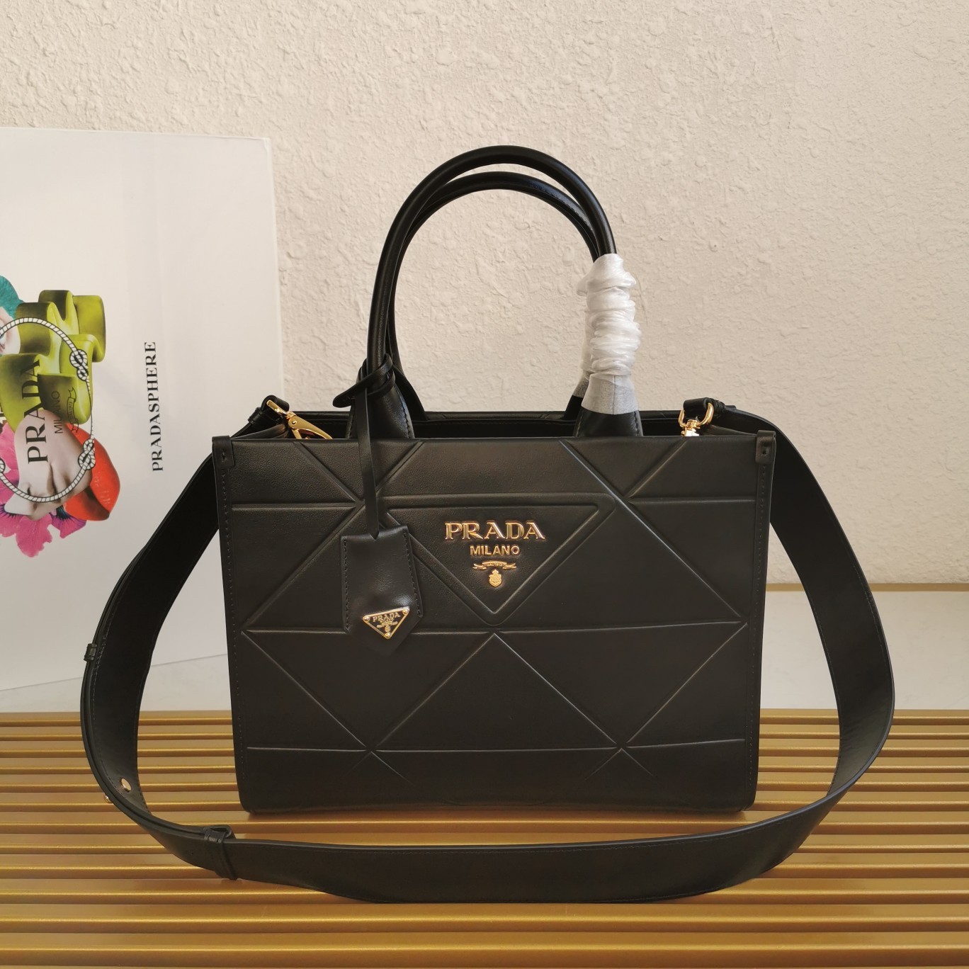 Pra*a symbole small bag with topstitching in black leather