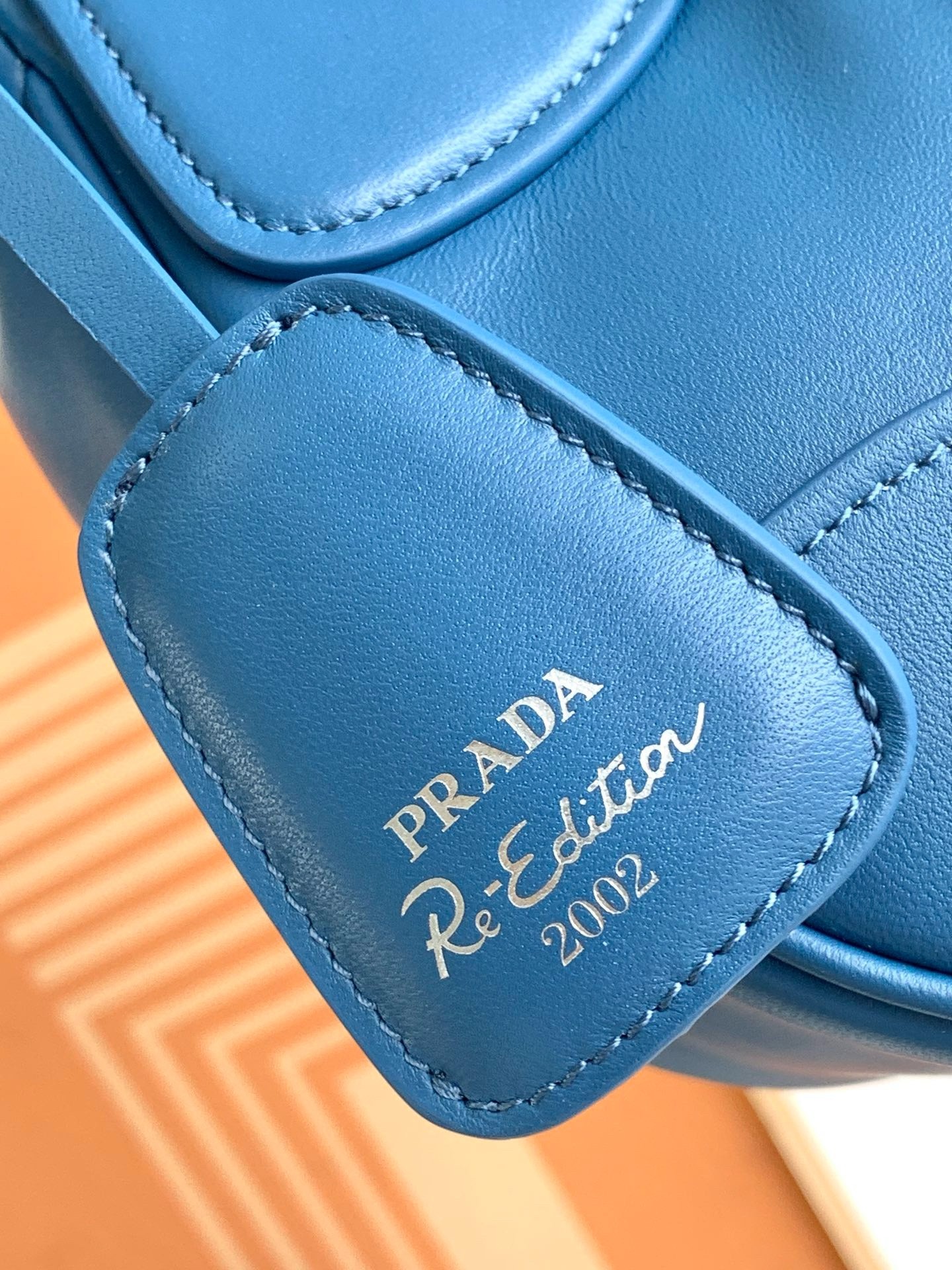 Pra*a moon bag in blue padded nappa leather