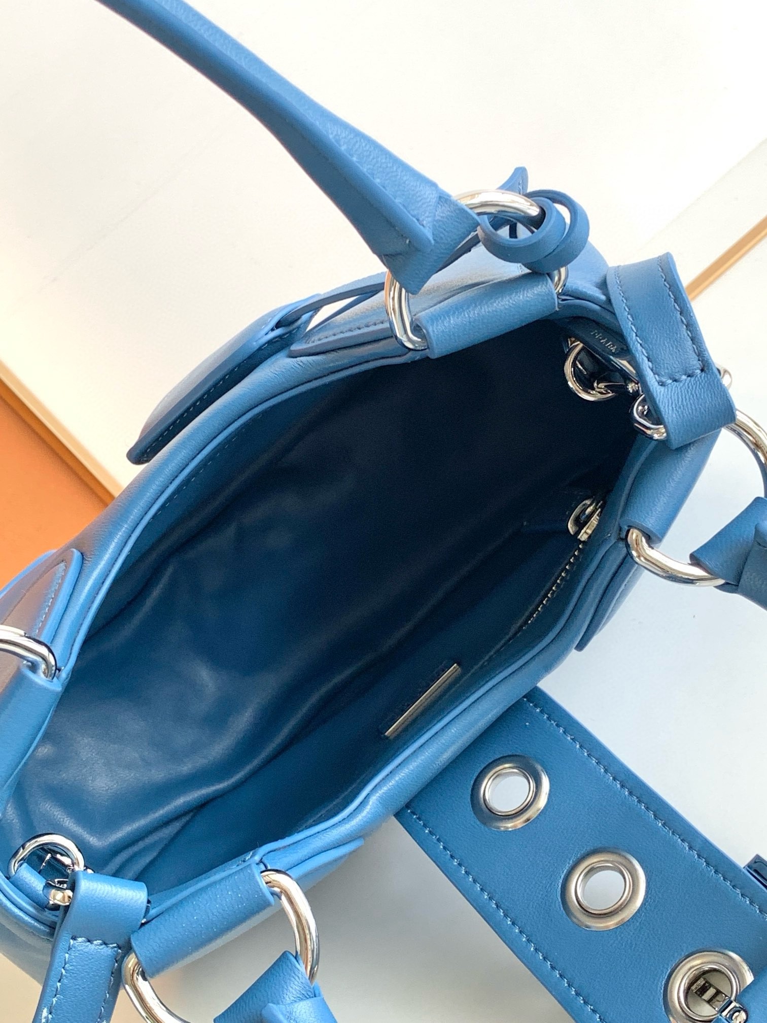 Pra*a moon bag in blue padded nappa leather
