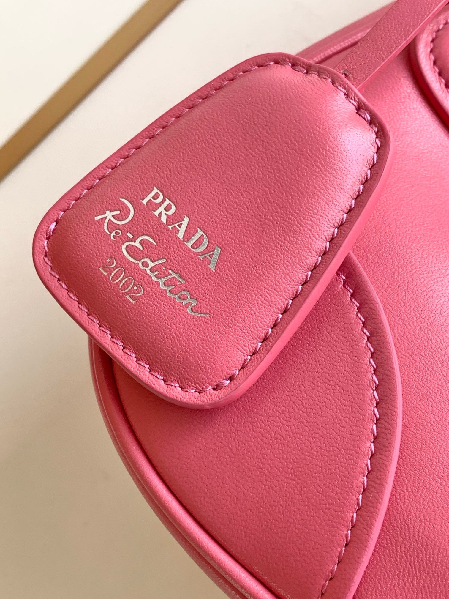 Pra*a moon bag in pink padded nappa leather