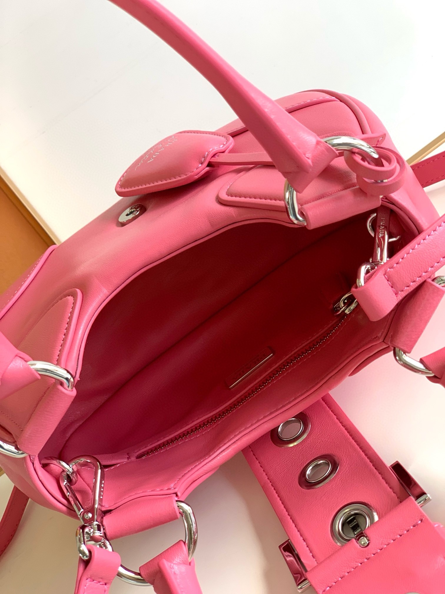 Pra*a moon bag in pink padded nappa leather