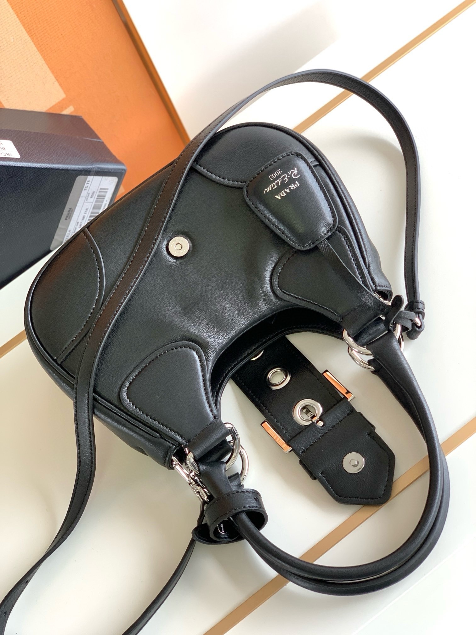 Pra*a moon bag in black re-nylon and leather