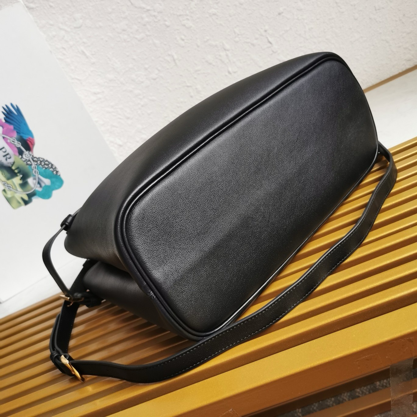 Pra*a buckle medium bag with double belt in black leather