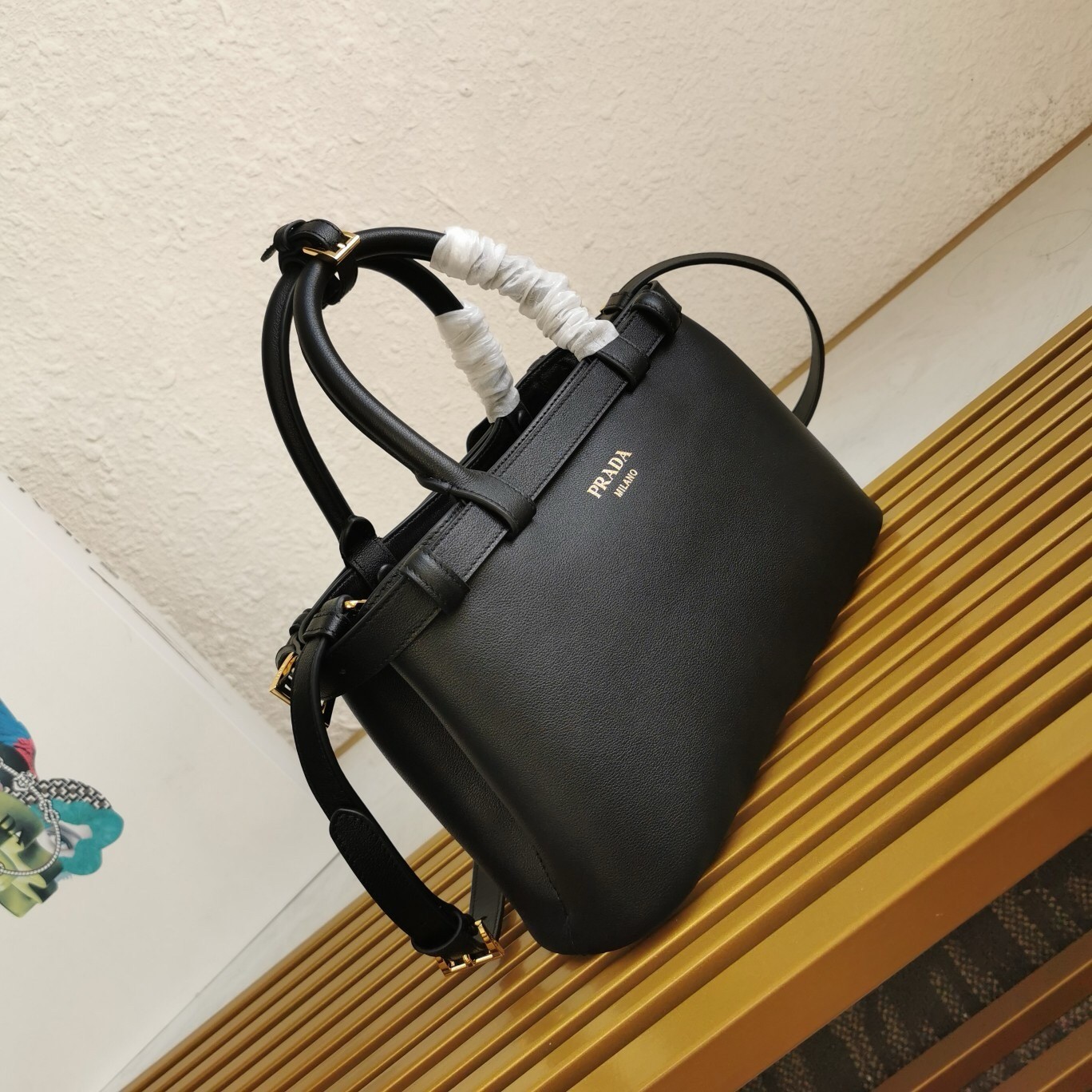 Pra*a small handbag in black leather with belt