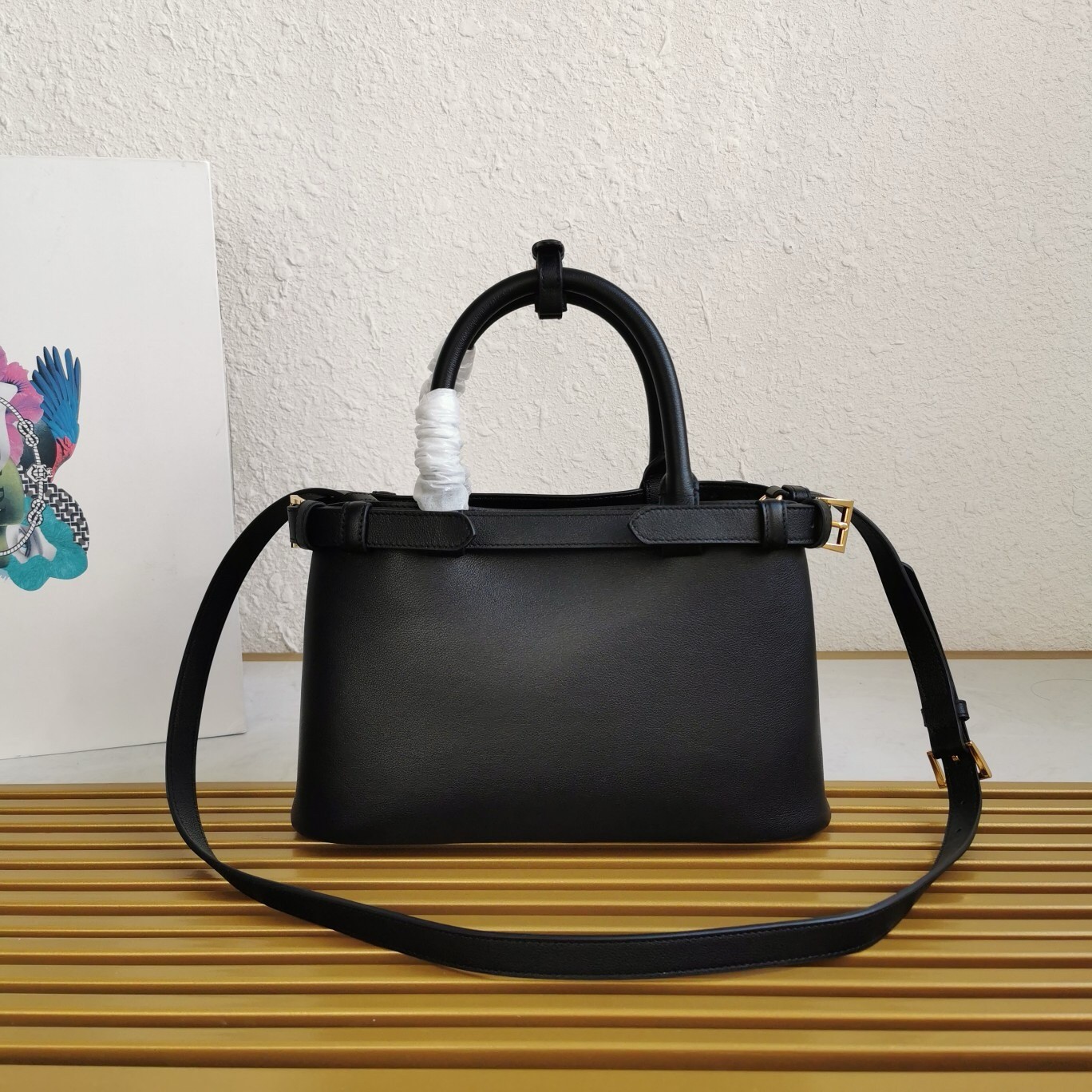 Pra*a small handbag in black leather with belt