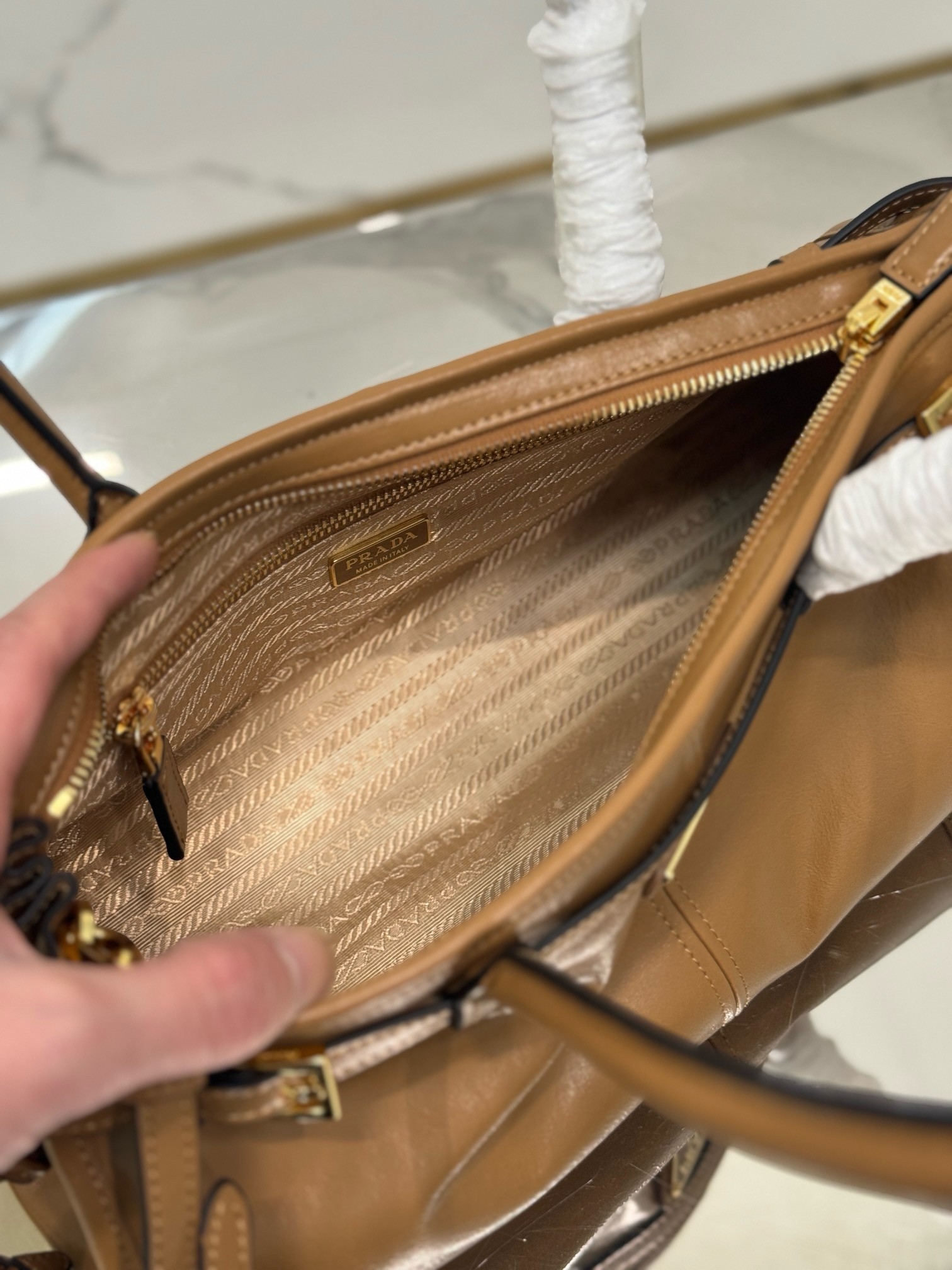 Pra*a medium tote bag in brown soft leather
