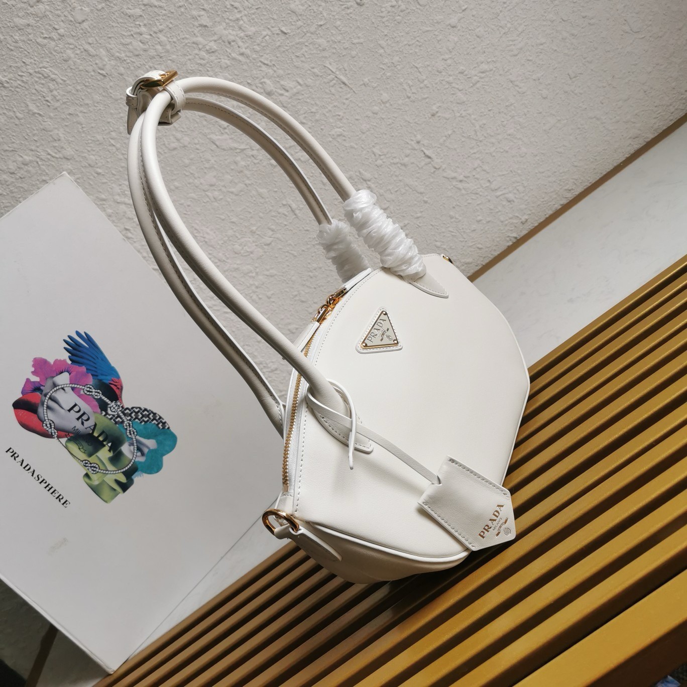 Pra*a shoulder bag with double zipper in white calfskin