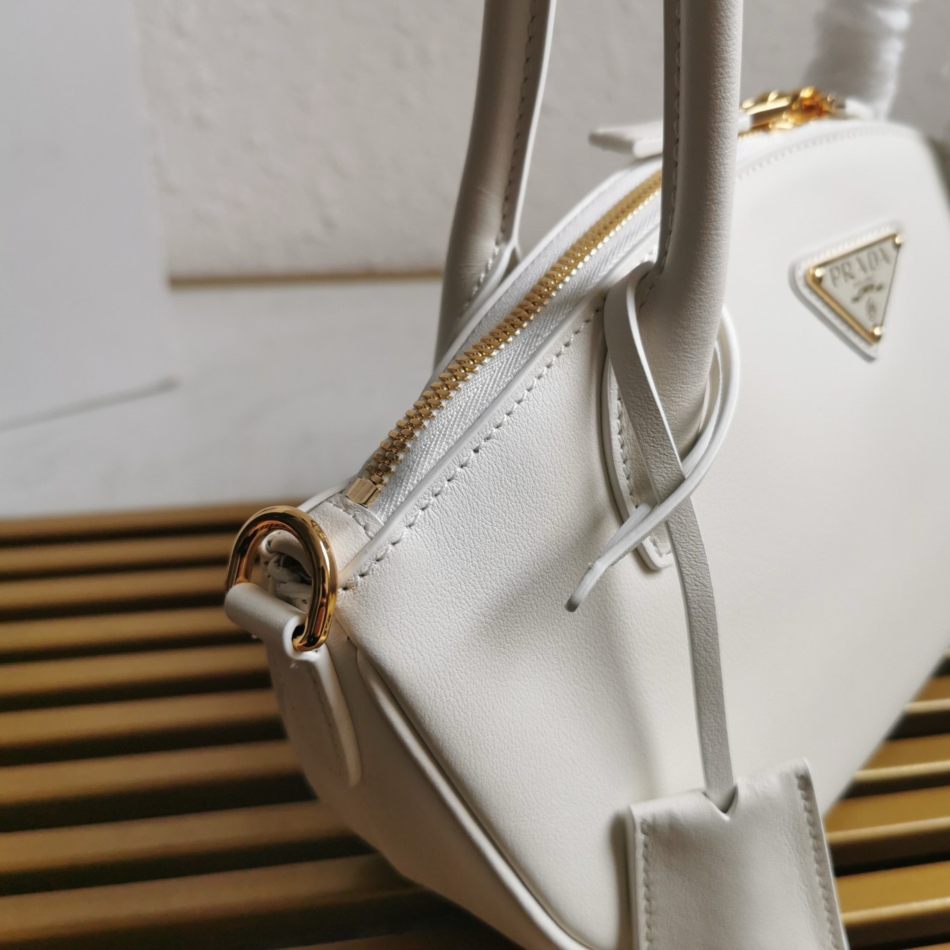 Pra*a shoulder bag with double zipper in white calfskin