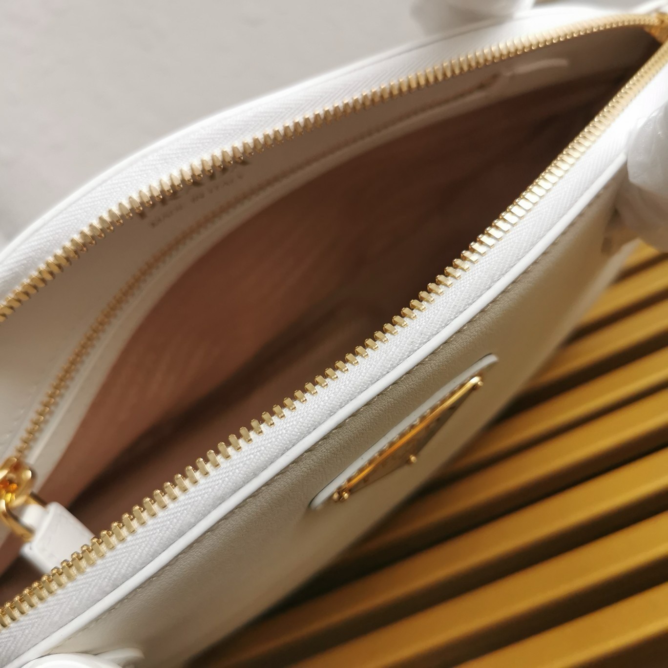 Pra*a shoulder bag with double zipper in white calfskin