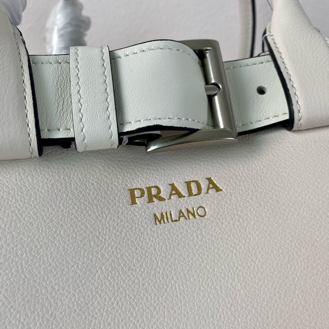 Pra*a buckle medium bag with belt in white leather