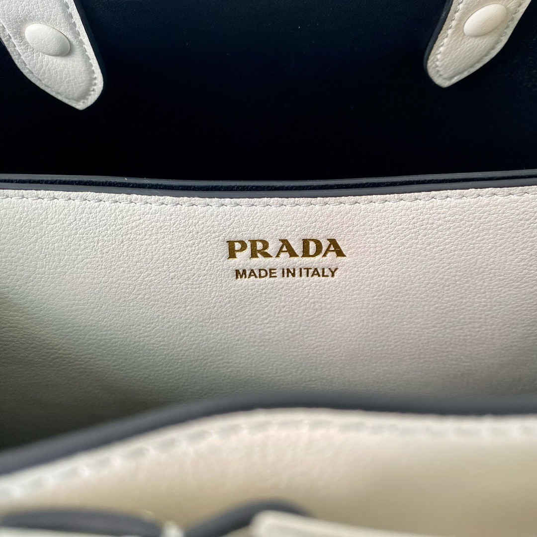 Pra*a buckle medium bag with belt in white leather