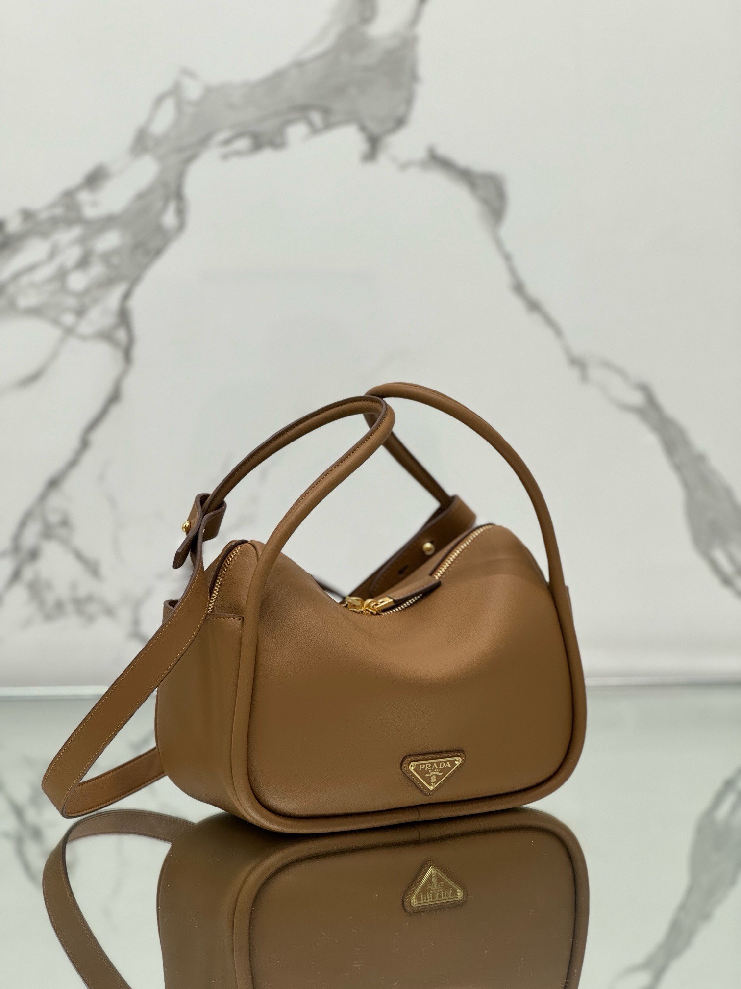 Pra*a top handle bag in caramel grained leather