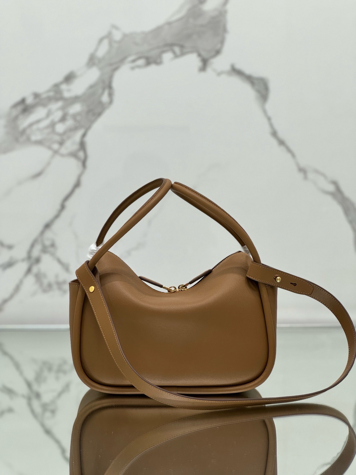 Pra*a top handle bag in caramel grained leather