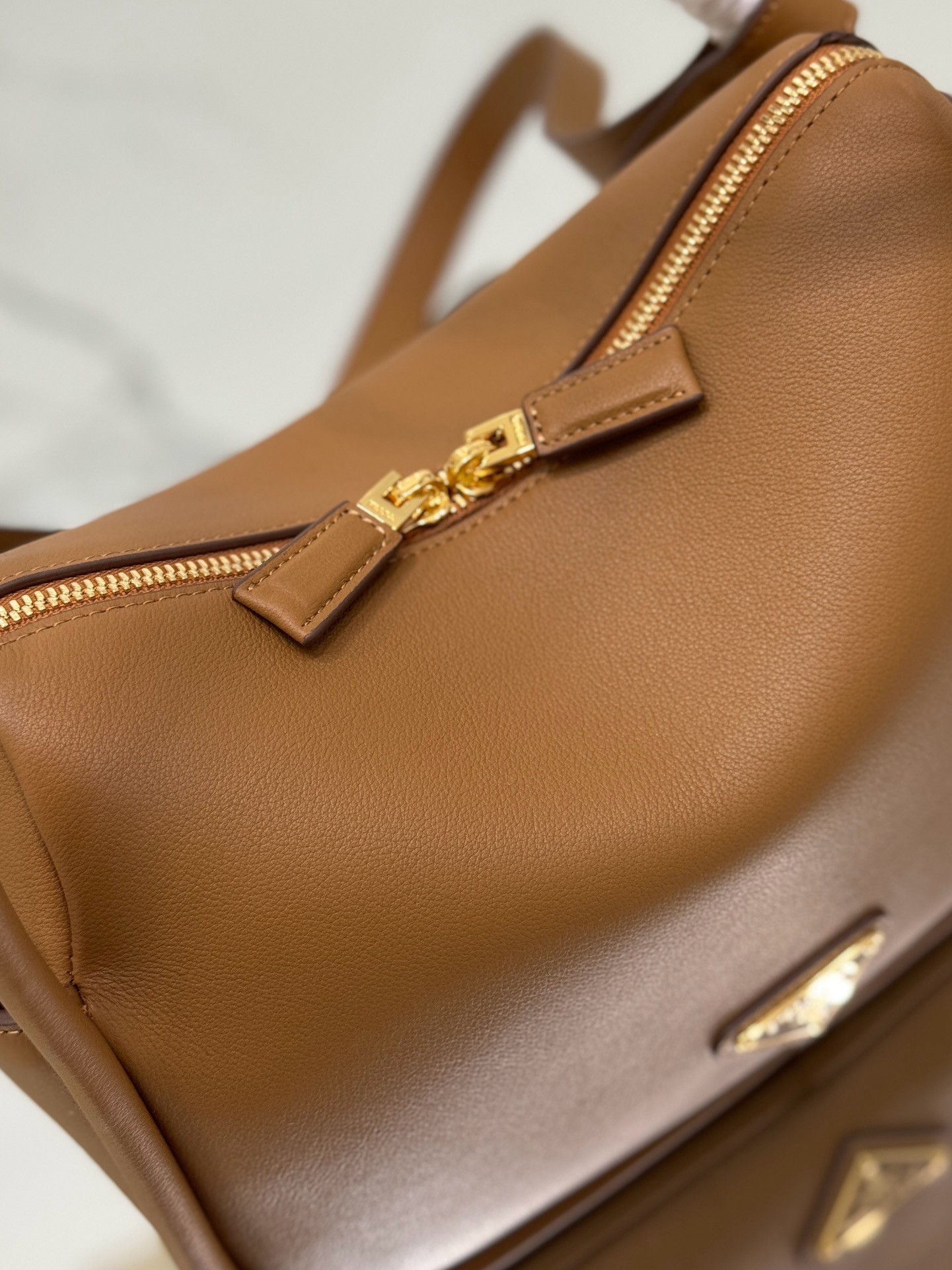 Pra*a top handle bag in caramel grained leather