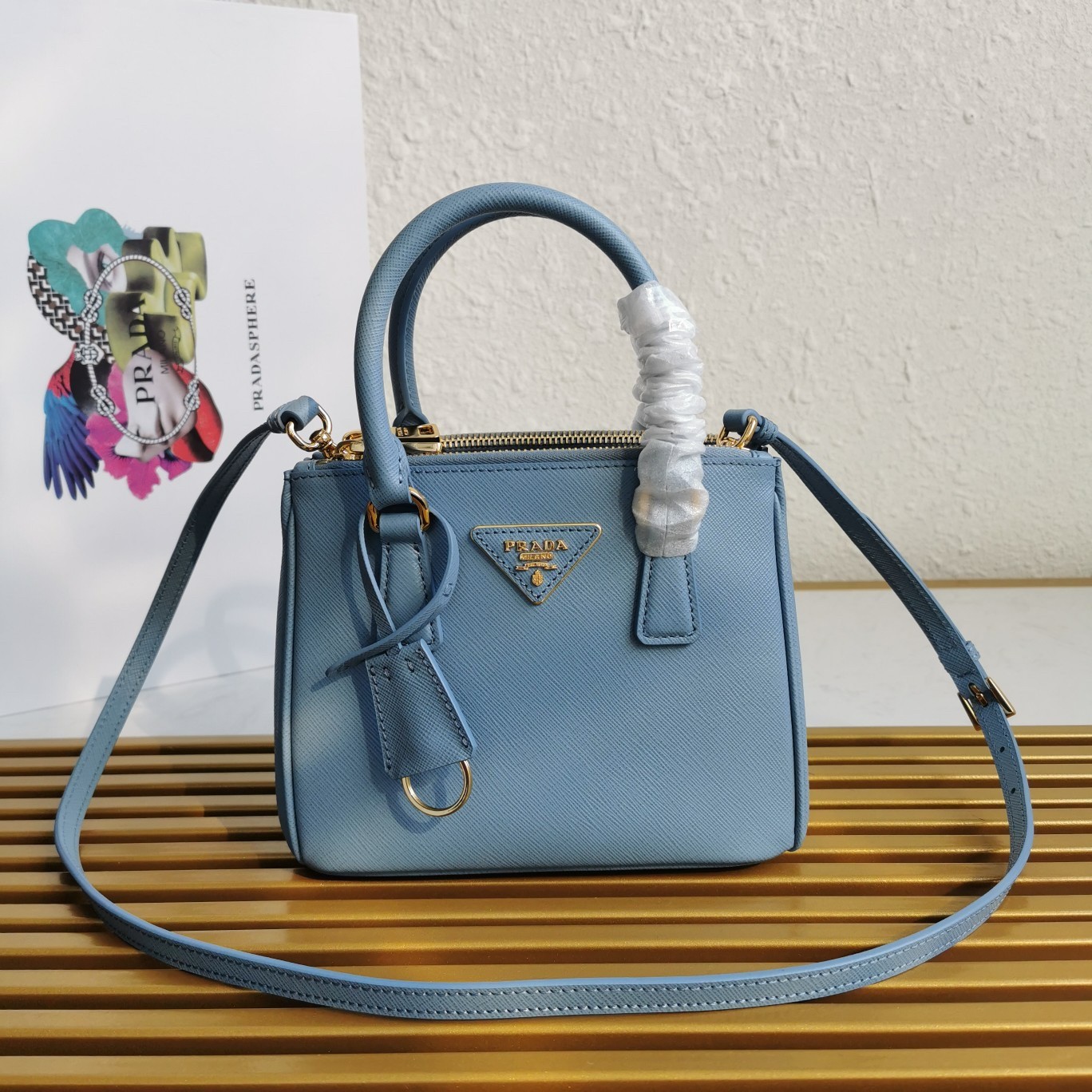 Pra*a mini galleria bag in light blue saffiano leather
