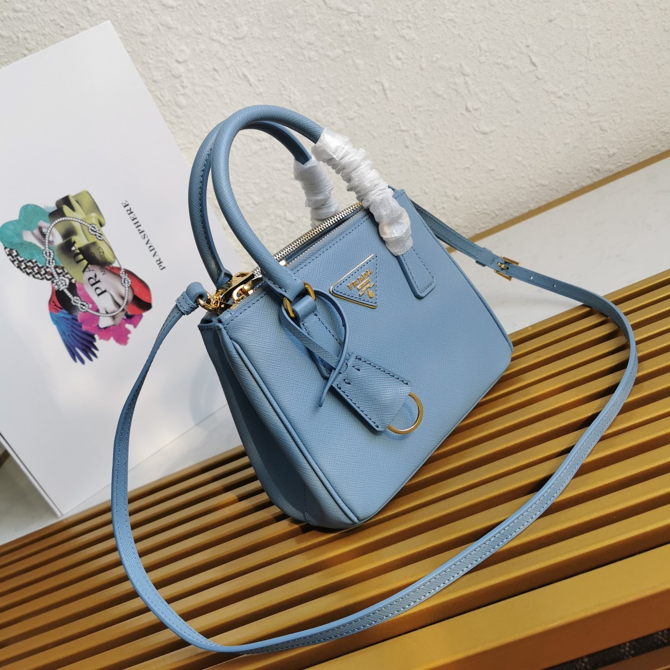 Pra*a mini galleria bag in light blue saffiano leather