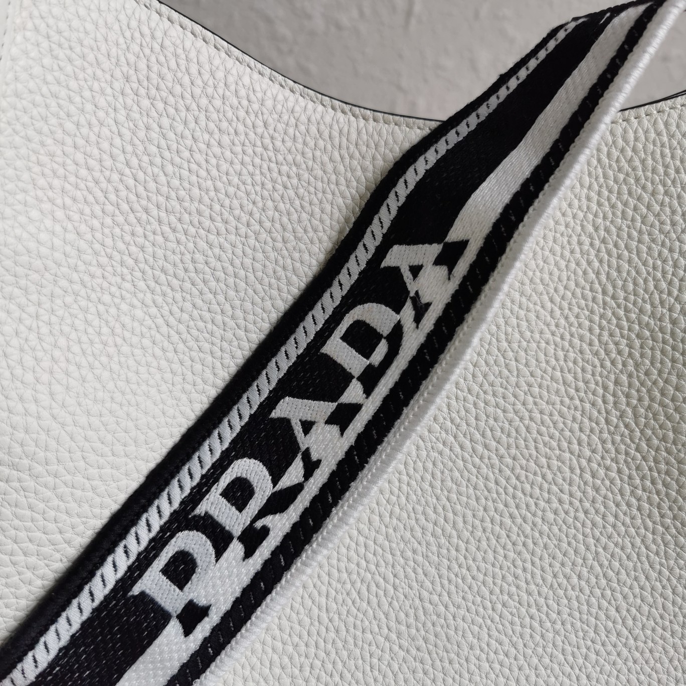 Pra*a hobo bag in white grained leather