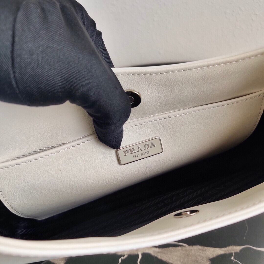 Pra*a cleo small shoulder bag in white brushed leather