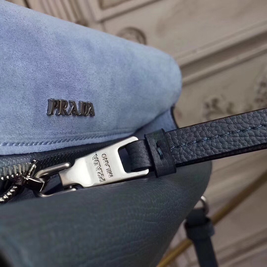 Pra*a etiquette bag in blue calfskin with metal stud trim