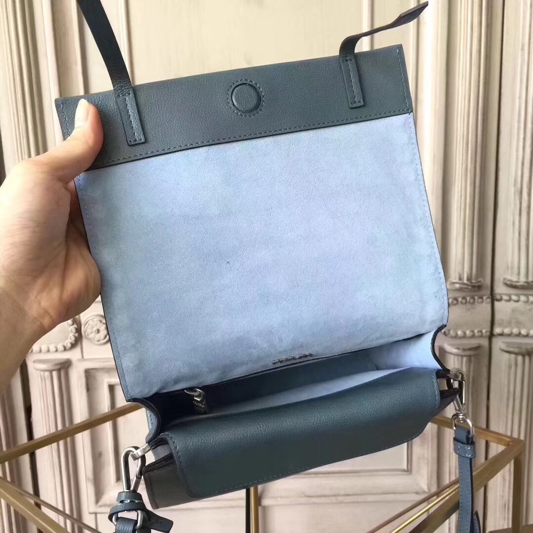 Pra*a etiquette bag in blue calfskin with metal stud trim