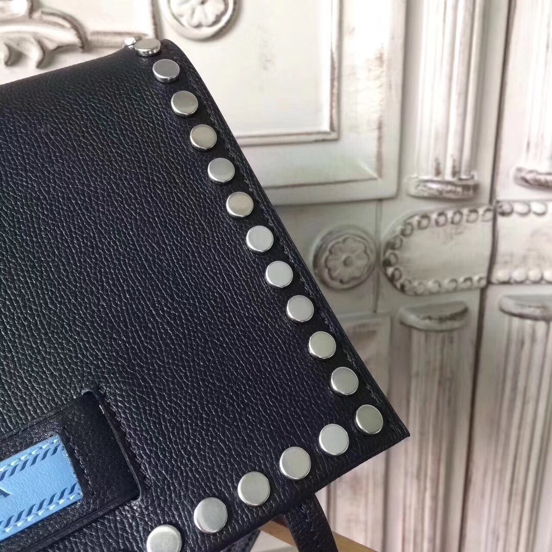 Pra*a etiquette bag in black calfskin with metal stud trim