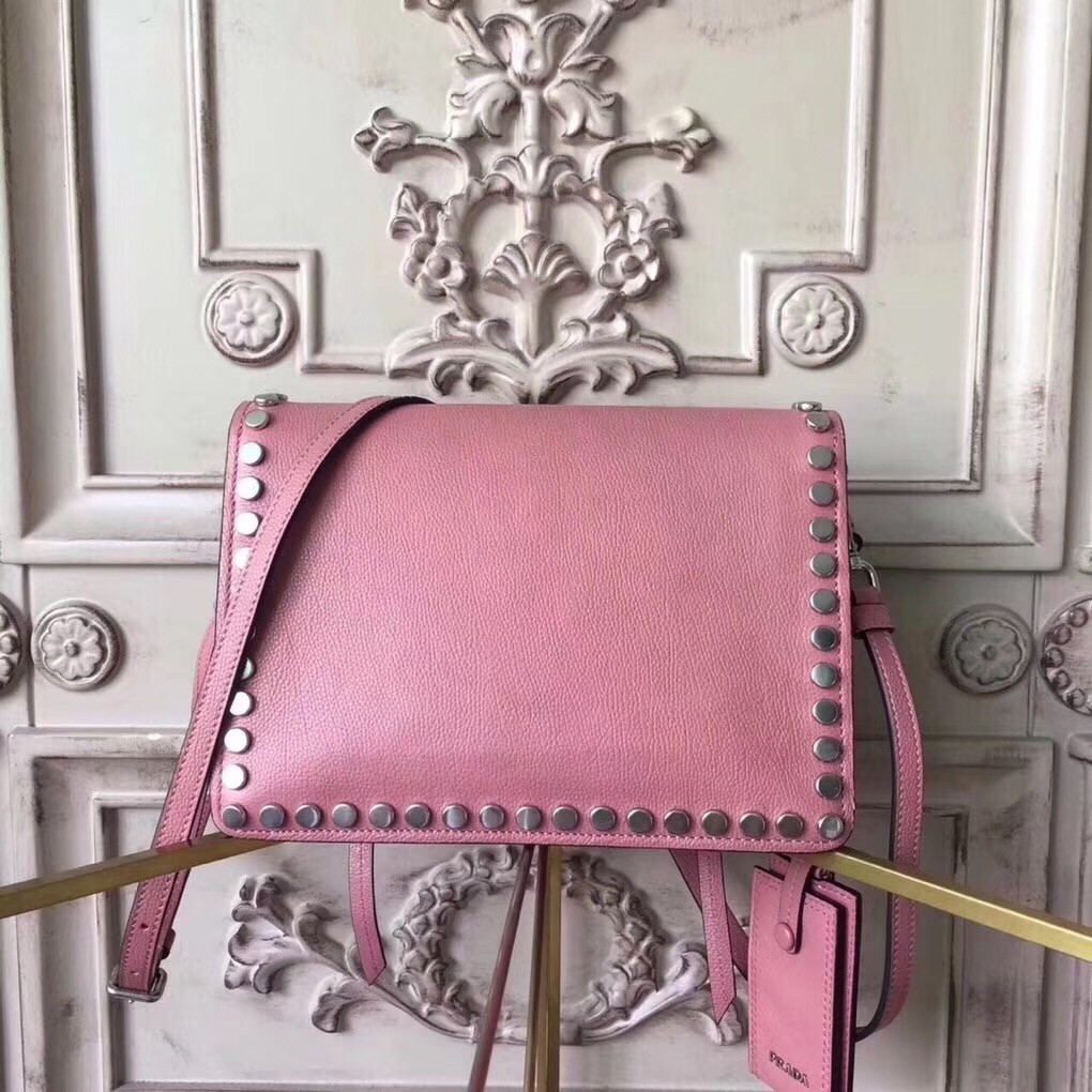 Pra*a etiquette bag in pink calfskin with metal stud trim