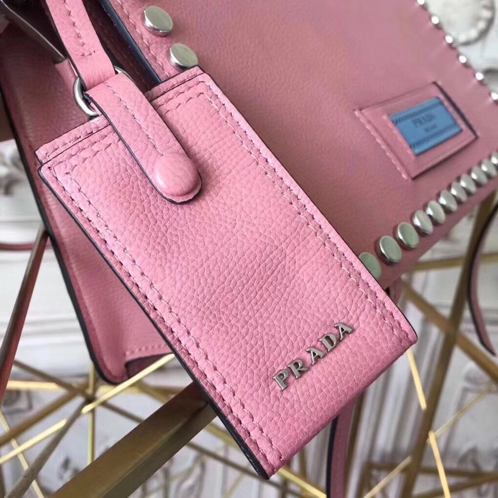 Pra*a etiquette bag in pink calfskin with metal stud trim
