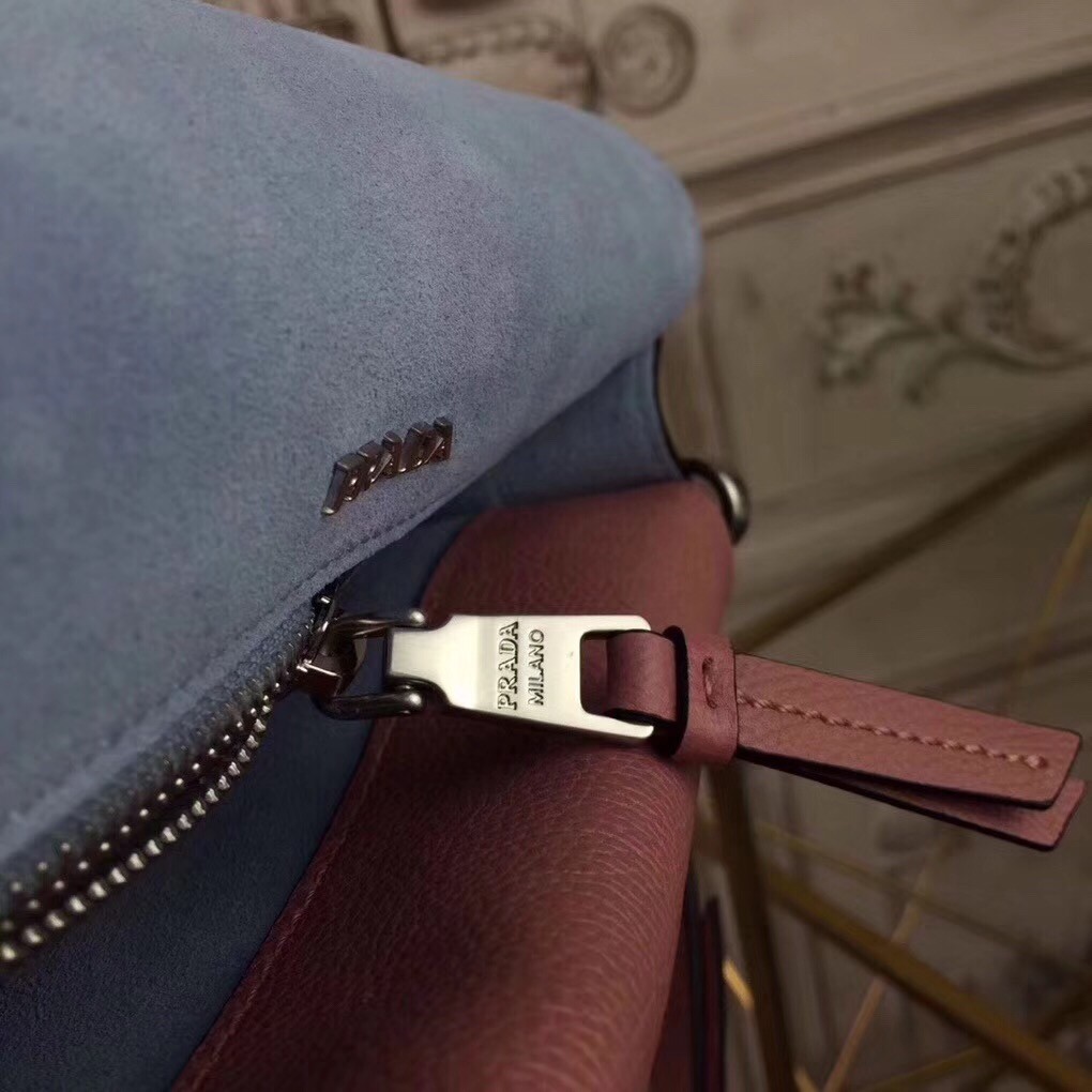 Pra*a etiquette bag in pink calfskin with metal stud trim