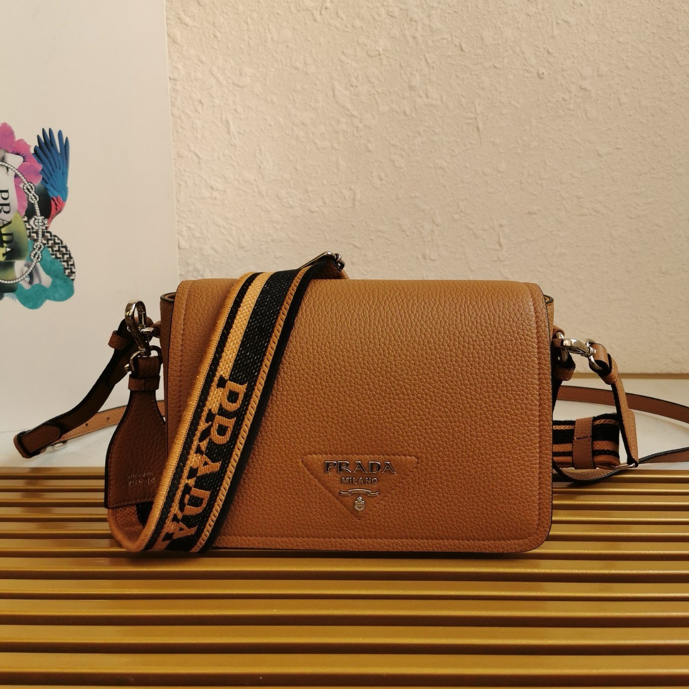 Pra*a flap shoulder bag in brown grained leather