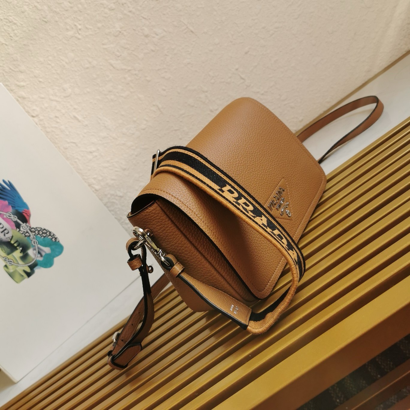 Pra*a flap shoulder bag in brown grained leather