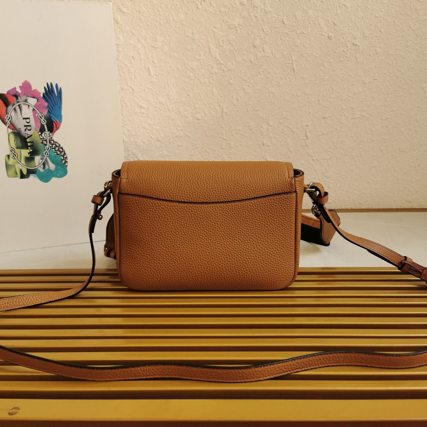 Pra*a flap shoulder bag in brown grained leather