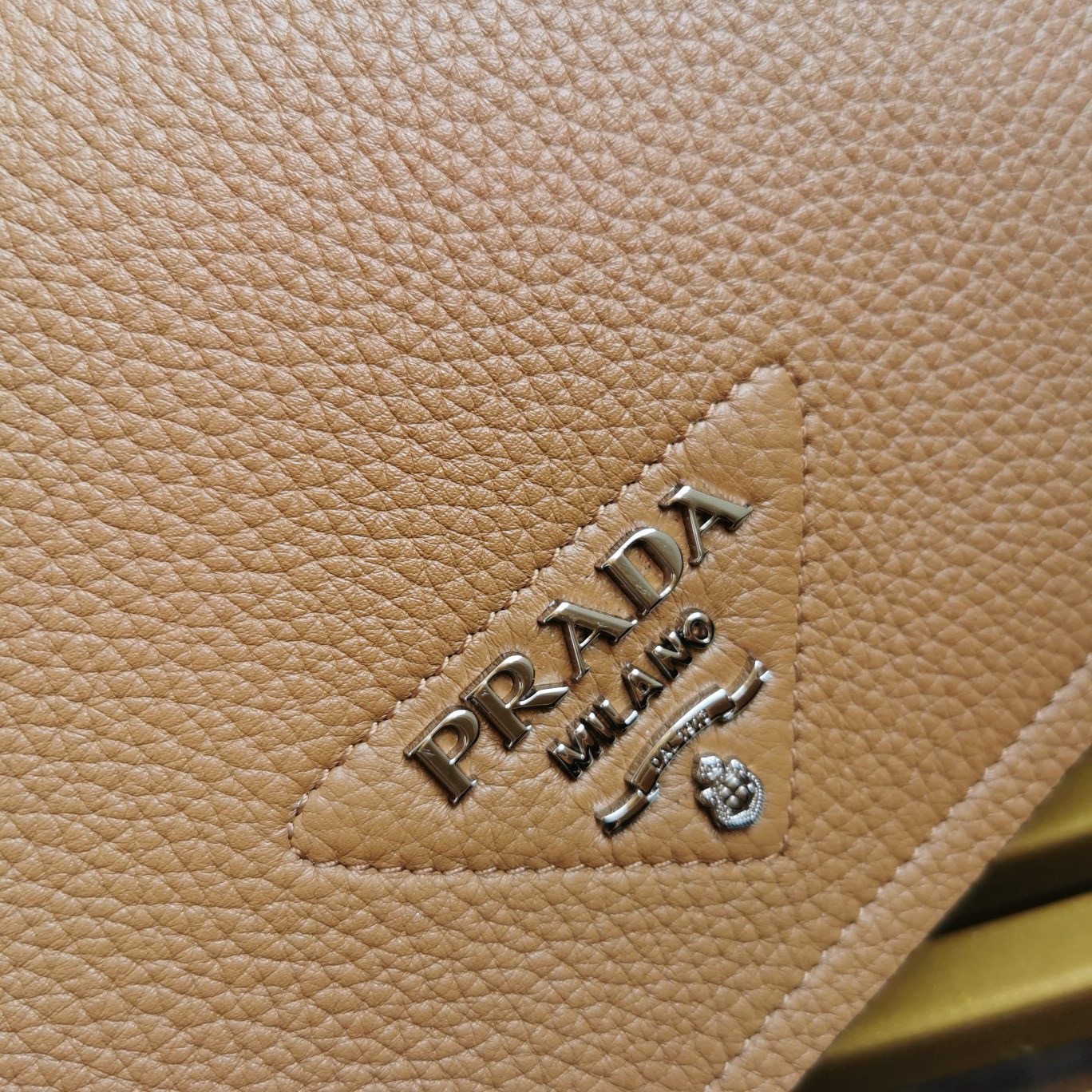 Pra*a flap shoulder bag in brown grained leather