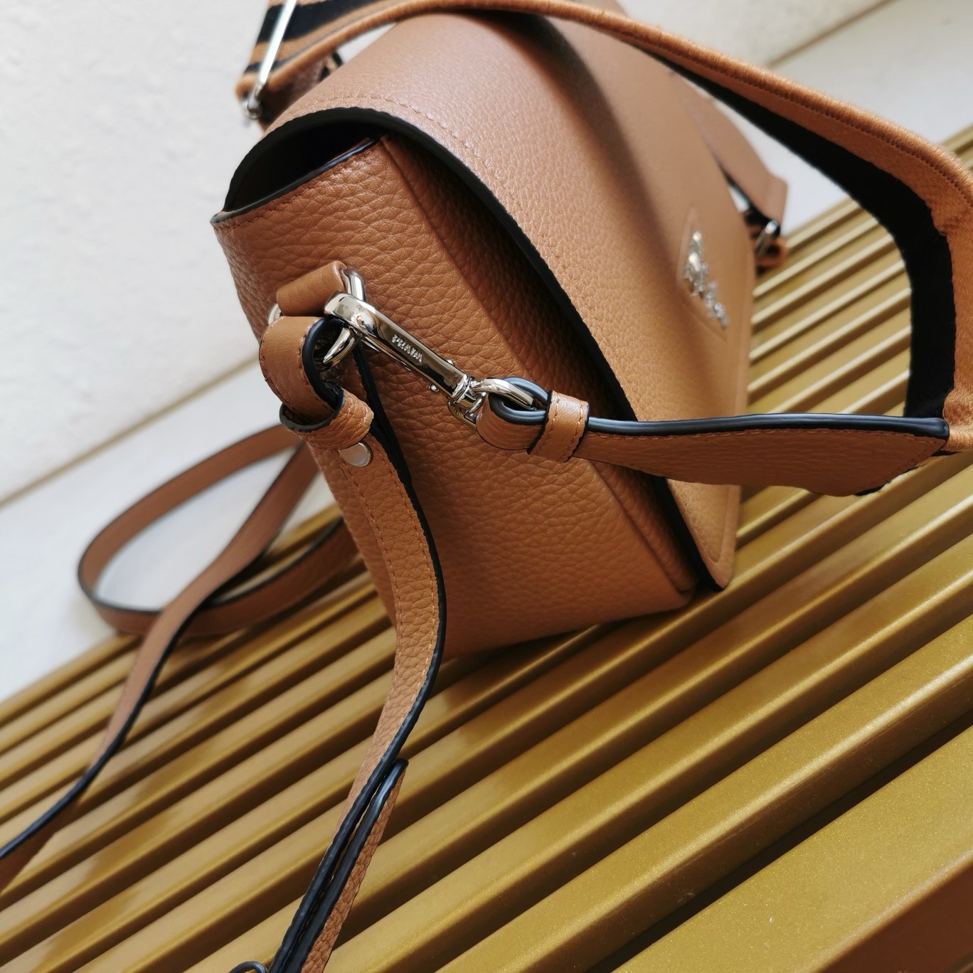 Pra*a flap shoulder bag in brown grained leather