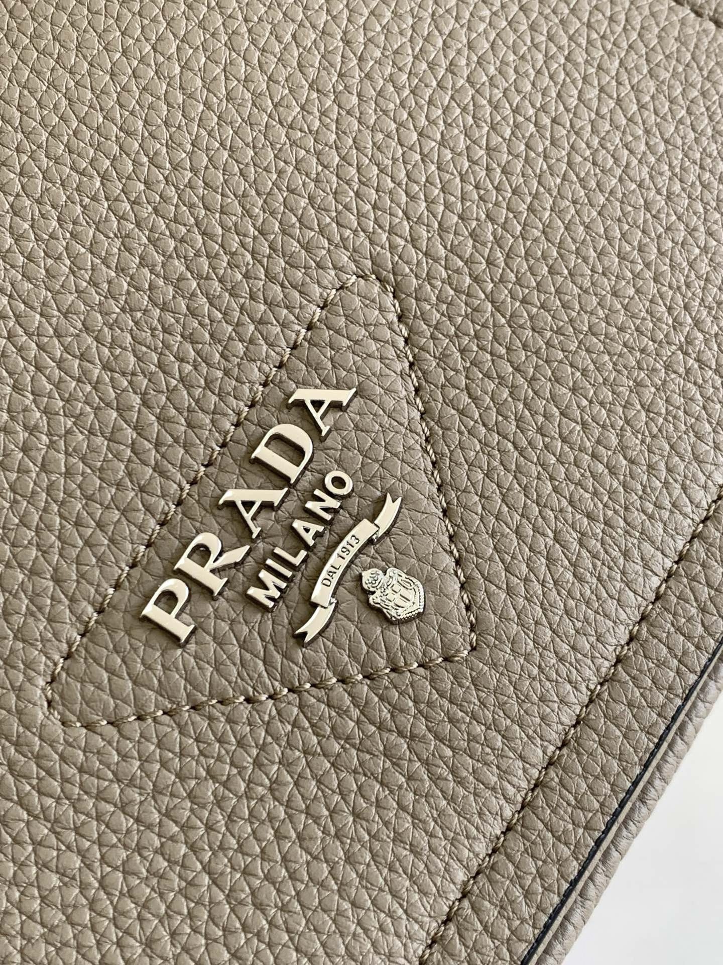 Pra*a flap shoulder bag in grey grained leather