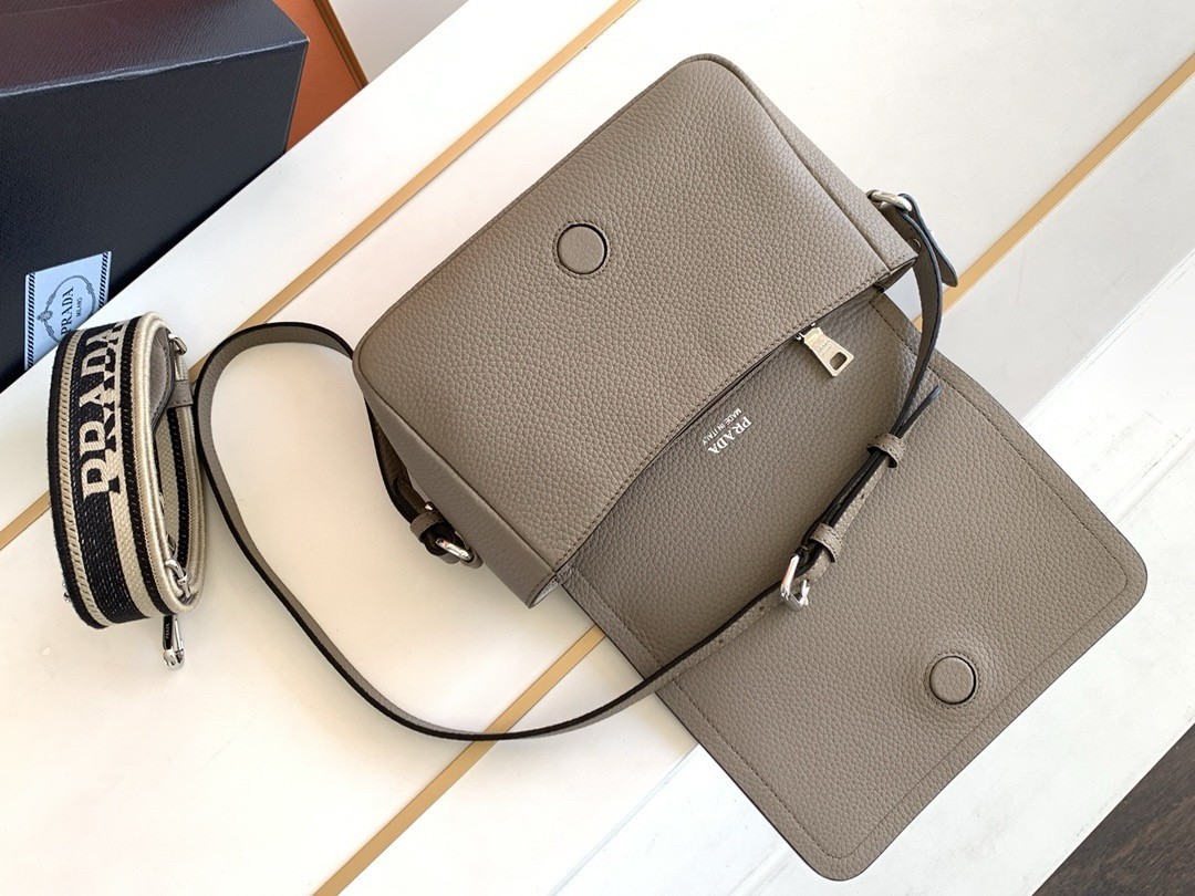 Pra*a flap shoulder bag in grey grained leather